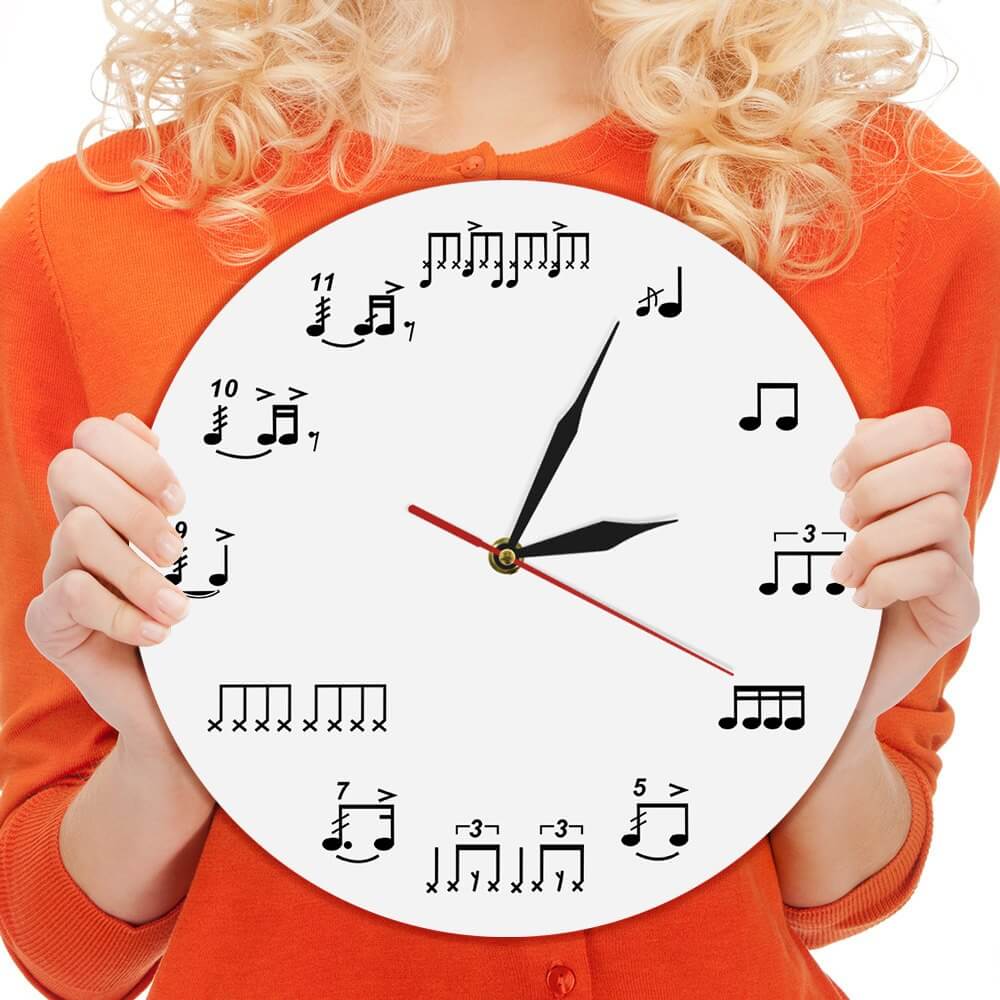 Picture of a lady holding a clock indicating the Daily Drum Diet by Skillz Drum Lessons